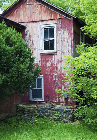 An old red barn in historic Lafayette Village in New Jersey.のeditorial素材