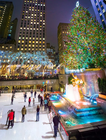 NEW YORK-DEC 5  Ice skaters and tourists are all around the famous Rockefeller Center Christmas tree on December 5, 2013 のeditorial素材