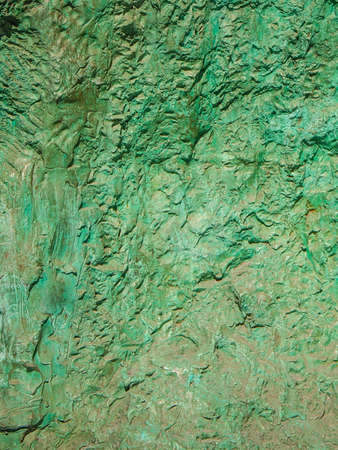 A textured stone background in the shade of aquar or jade の写真素材