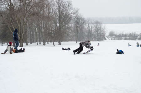 FREEHOLD, NEW JERSEY USA  February 15  Kids enjoy sledding at Monmouth Battlefield State Park on February 15, 2014 のeditorial素材