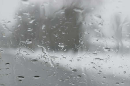 A neutral raindrop background with limited depth of field の写真素材