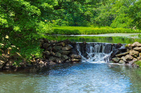 A small quiet waterfall in Duke Farms in Central New Jersey の写真素材