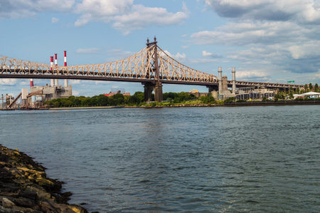 The Ed Koch Queensboro Bridge and power plants along the East River in Queens の写真素材