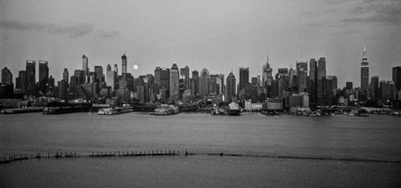 NEW YORK-AUGUST 10-A black and white panoramic film photograph of the New York City Skyline with the large moon on August 10 2014.のeditorial素材
