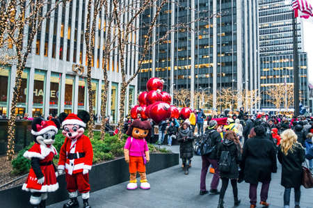 NEW YORK-DECEMBER 30: Characters in costume, tourists and holiday decorations near Rockefeller Center on December 30, 2013 in Manhattan.のeditorial素材