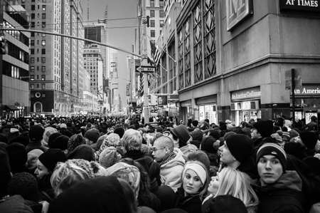 NEW YORK-DECEMBER 31: Large crowd gathers hours before the New Years Eve celebration in Times Square on December 31, 2013 in Manhattan.のeditorial素材