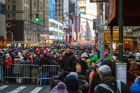 NEW YORK-DECEMBER 31: Large crowd gathers hours before the New Years Eve celebration in Times Square on December 31, 2013 in Manhattan.のeditorial素材