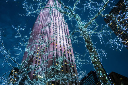 NEW YORK-DECEMBER 12: Looking up at the skyscraper and Christmas lights in Rockefeller Center during the holiday season on December 12, 2014 in Manhattan.のeditorial素材