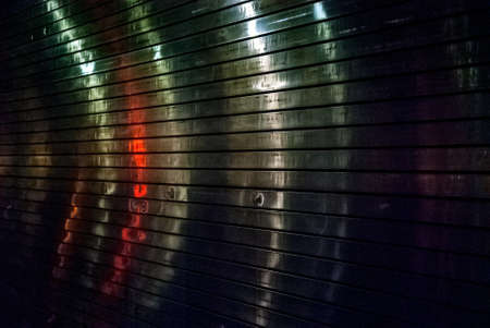 Colored light reflections on this steel wall somewhere in New York City.の写真素材