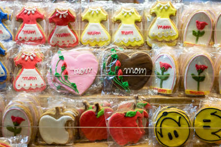 Colorful Mothers Day cookies on display in a bake shop.の写真素材