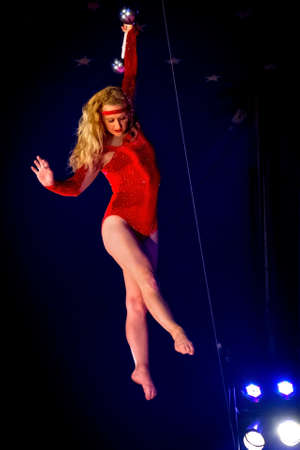 OLD BRIDGE, NEW JERSEY -JUNE 8 - Kimberly Souren a trapeze artist hanging from the bar at the Kelly Miller Circus on June 8 2015 in Old Bridge New Jersey.のeditorial素材