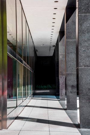 Sunlight streams through this contemporary building walkway in New York City.