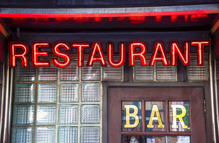 A glowing restaurant bar neon sign image.の写真素材