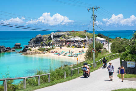 ST.GEORGE,BERMUDA, MAY 27 - Tourists on the road overlooking Tobacco Bay, a beautiful secluded beach on May 27 2016 in Bermuda.のeditorial素材