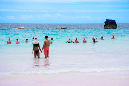 HORSESHOE BAY, BERMUDA - MAY 26 - A couple enjoys the pristine turquoise colored water of Horseshoe...