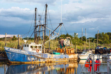 MIDDLETOWN, NEW JERSEY- AUGUST 6 - Commercial fishing boat on Shoal Harbor on August 6 2016 in Middletown NJ.のeditorial素材