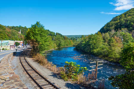 JIM THORPE, PENNSYLVANIA, - SEPTEMBER 28: Railroad tracks along the Lehigh River lead into Scenic Jim Thorpe on September 28 2016 in Pennsylvaniaのeditorial素材