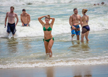 BELMAR, NEW JERSEY-AUGUST 1- Sunbathers enjoy the surf as a heat wave made for a perfect beach day on August 1 2015 in Belmar New Jersey.のeditorial素材