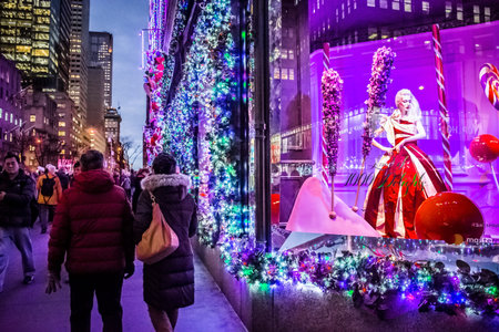 NEW YORK-DECEMBER 7: Tourists and New Yorkers admire the holiday decorations and lights on Fifth...