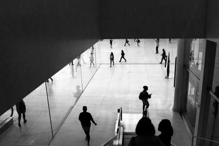 A silhouette view of daily commuters in a New York train station.の写真素材