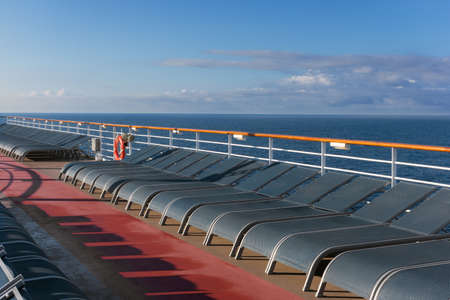 A repition of lounge chairs on a cruise ship in the Atlantic.の写真素材
