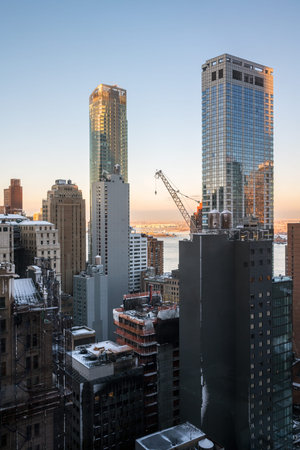 NEW YORK-MARCH 8: An early morning view of a large crane high up on a skyscraper on March 8 2018 in lower Manhattan.のeditorial素材