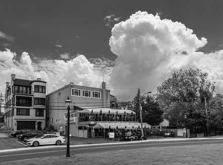 KEYPORT, NEW JERSEY - JUNE 2 - A large cumulonimbus cloud as seen over this neighborhood on June 2 2018 in Keyport New Jersey.のeditorial素材