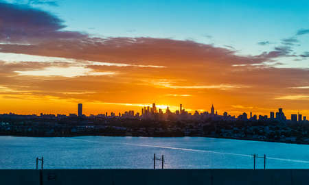 A scenic sunrise view of Manhattan as seen from Jersey City.の写真素材
