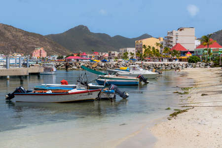 PHILLIPSBURG, ST. MARTEEN - JULY 11 - A series of small boats close to the boardwalk area along the beach on July 11 2018 in Phillipsburg St. Marteen.のeditorial素材
