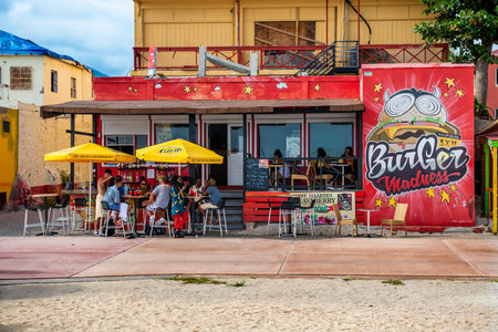 PHILLIPSBURG, ST. MAARTEN - JULY 11 - Colorful boardwalk restaurant with tourists and local people on July 11 2018 in Phillipsburg, St. Marteen.のeditorial素材