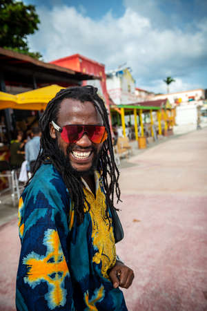 PHILLIPSBURG, ST. MAARTEN - JULY 11 - A friendly local guy with dreadlocks and colorful clothing on July 11 2018 in Phillipsburg, St. Marteen.のeditorial素材