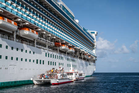 PRINCESS CAYS, BAHAMAS - JULY 8 - Tender boats bring the passengers ashore on July 8 2018 because of the shallow water surrounding the small island Princess Cays in the Bahamas.のeditorial素材