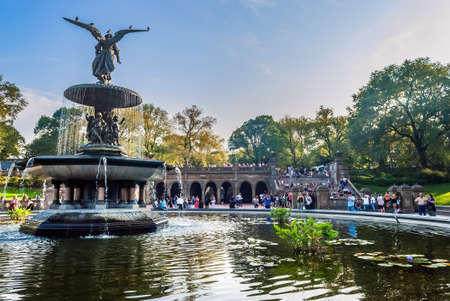 NEW YORK-SEPTEMBER  24: People enjoy a scenic view of the Bethesda Fountain and pool in Central Park on September 24 2010 in Manhattan.のeditorial素材