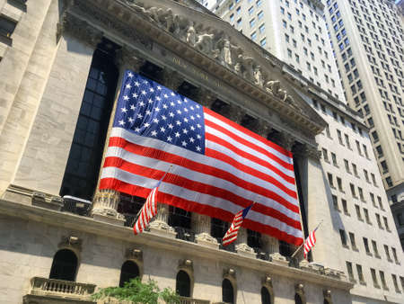 NEW YORK-JULY 3: A very large American flag drapes the New York Stock Exchange on July 3 2018 in lower Manhattan.のeditorial素材