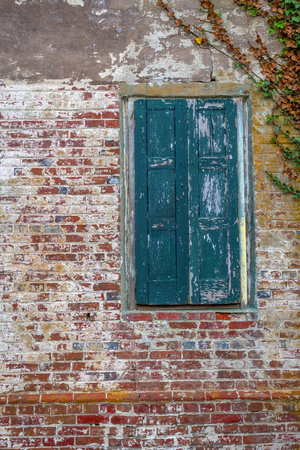 Antique brick and old shutters on this abandoned winerey in New Egypt New Jersey.