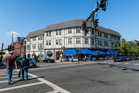 SLEEPY HOLLOW, NEW YORK - SEPTEMBER 18: A couple crosses at the intersection on September 18 2021 in downtown Sleepy Hollow in New York state.のeditorial素材