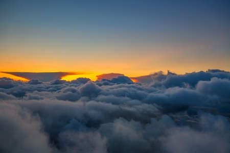The tops of the clouds at dusk above Alaska.の写真素材