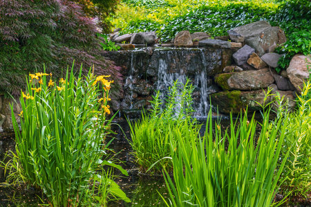 A pretty ornamental garden waterfall near New Hope Pennsylvania.の写真素材