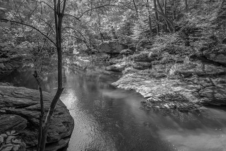 Rock formations along Pequea Creek in Fox Hollow Nature Preserve in Lancaster County, Pennsylvania.の写真素材