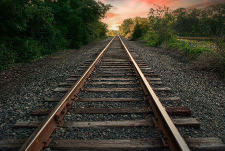 The sunsets over these railroad tracks that pass through Thompson Park in Middlesex County, New Jersey.の写真素材