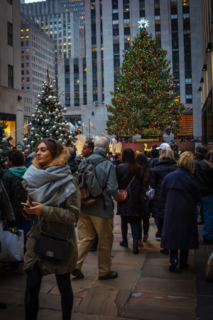 NEW YORK-DECEMBER 7: Tourists visit the Rockefeller Center Christmas tree on December 7 2015 in midtown Manhattan.のeditorial素材