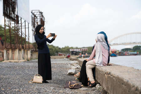 Kedah,Malaysia - asian hijab's girl taking photo in the tourist spot when holiday in Kedah,Malaysia.のeditorial素材