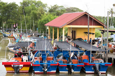 Kedah,Malaysia - 11-05-2019 : the wooden fisherman boat parking at the pier when finish the harvesting activity.のeditorial素材