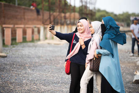 Kedah,Malaysia - asian hijab's girl taking photo in the tourist spot when holiday in Kedah,Malaysia.のeditorial素材