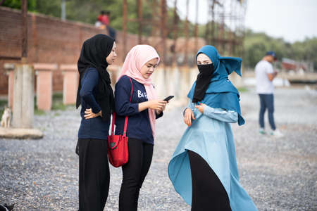 Kedah,Malaysia - 11-05-2019 : malay hijab's girl relaxing on the seaside when in holiday.のeditorial素材
