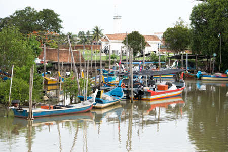 Kedah,Malaysia - 11-05-2019 : the wooden fisherman boat parking at the pier when finish the harvesting activity.のeditorial素材
