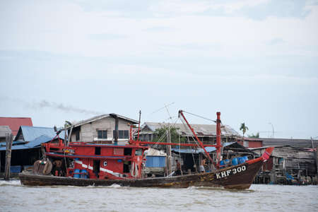 Kedah,Malaysia - 11-05-2019 : the wooden fisherman boat parking at the pier when finish the harvesting activity.のeditorial素材