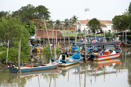 Kedah,Malaysia - 11-05-2019 : the wooden fisherman boat parking at the pier when finish the harvesting activity.のeditorial素材