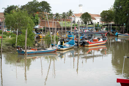 Kedah,Malaysia - 11-05-2019 : the wooden fisherman boat parking at the pier when finish the harvesting activity.のeditorial素材