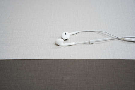 White earphone on the wooden tableの写真素材